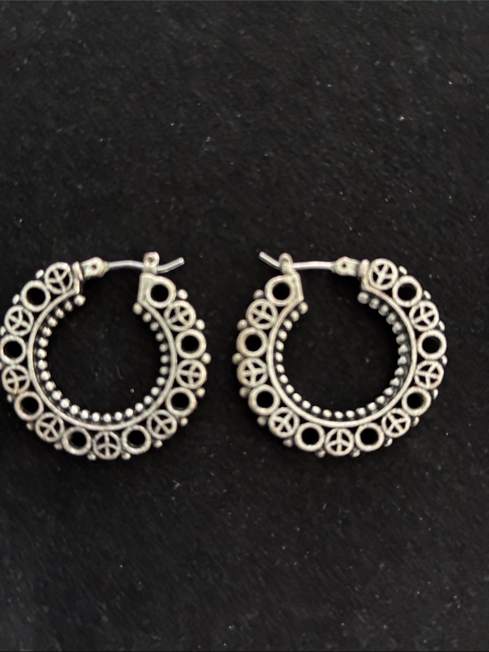Silvertone hoops with peace sign